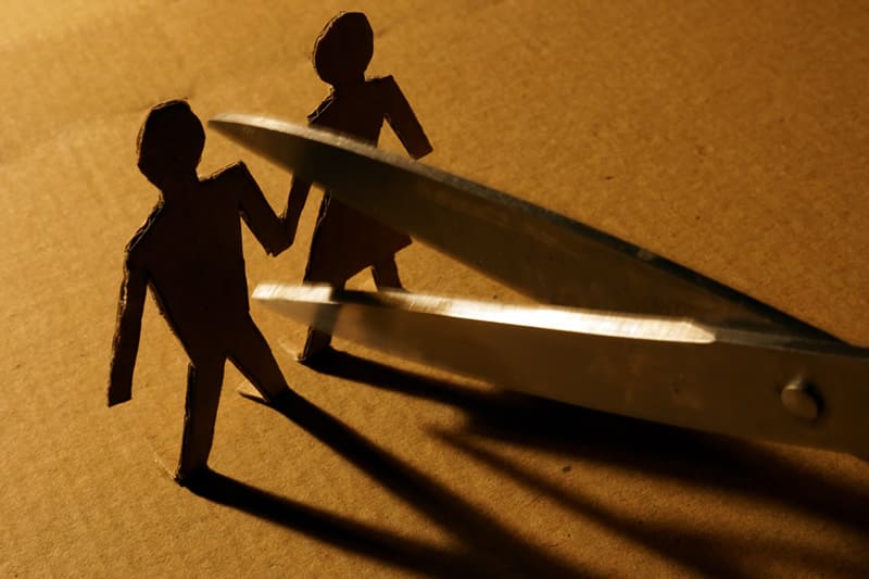 Graphic of couple being cut apart with scissors to illustrate marriage annulment in Georgia